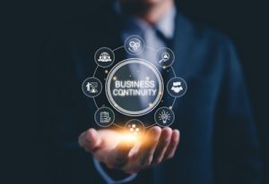 Business Continuity concept with digital icons representing risk management, data protection, and recovery solutions.