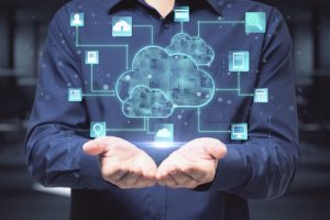 Business professional presenting a cloud computing concept with a digital network overlay, symbolizing cloud migration, hybrid cloud solutions, and secure cloud infrastructure.